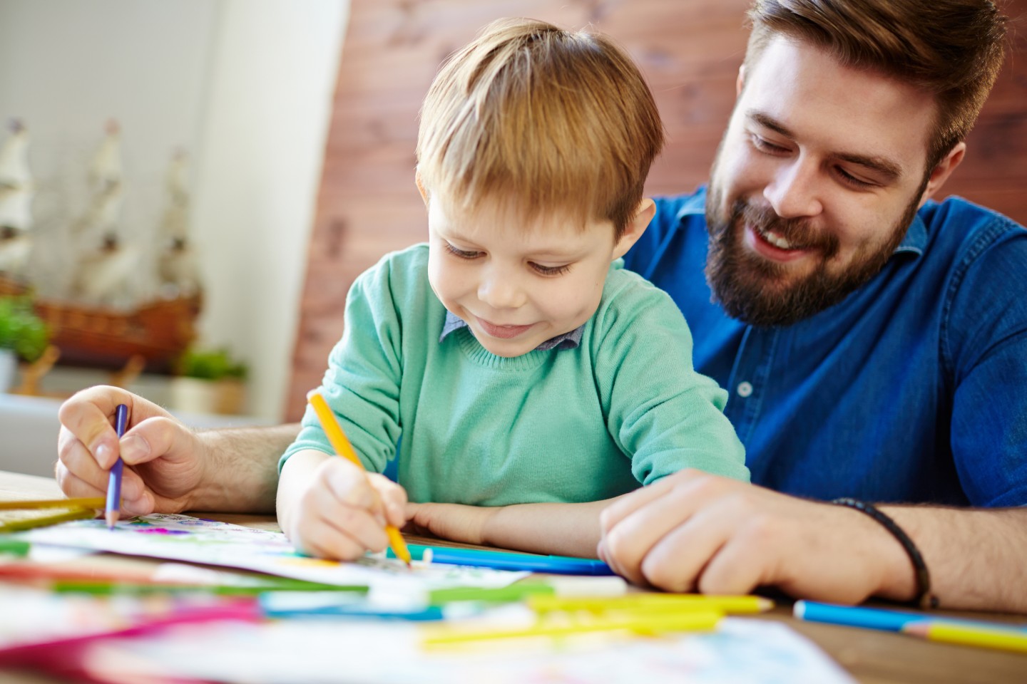 father and son doing art together